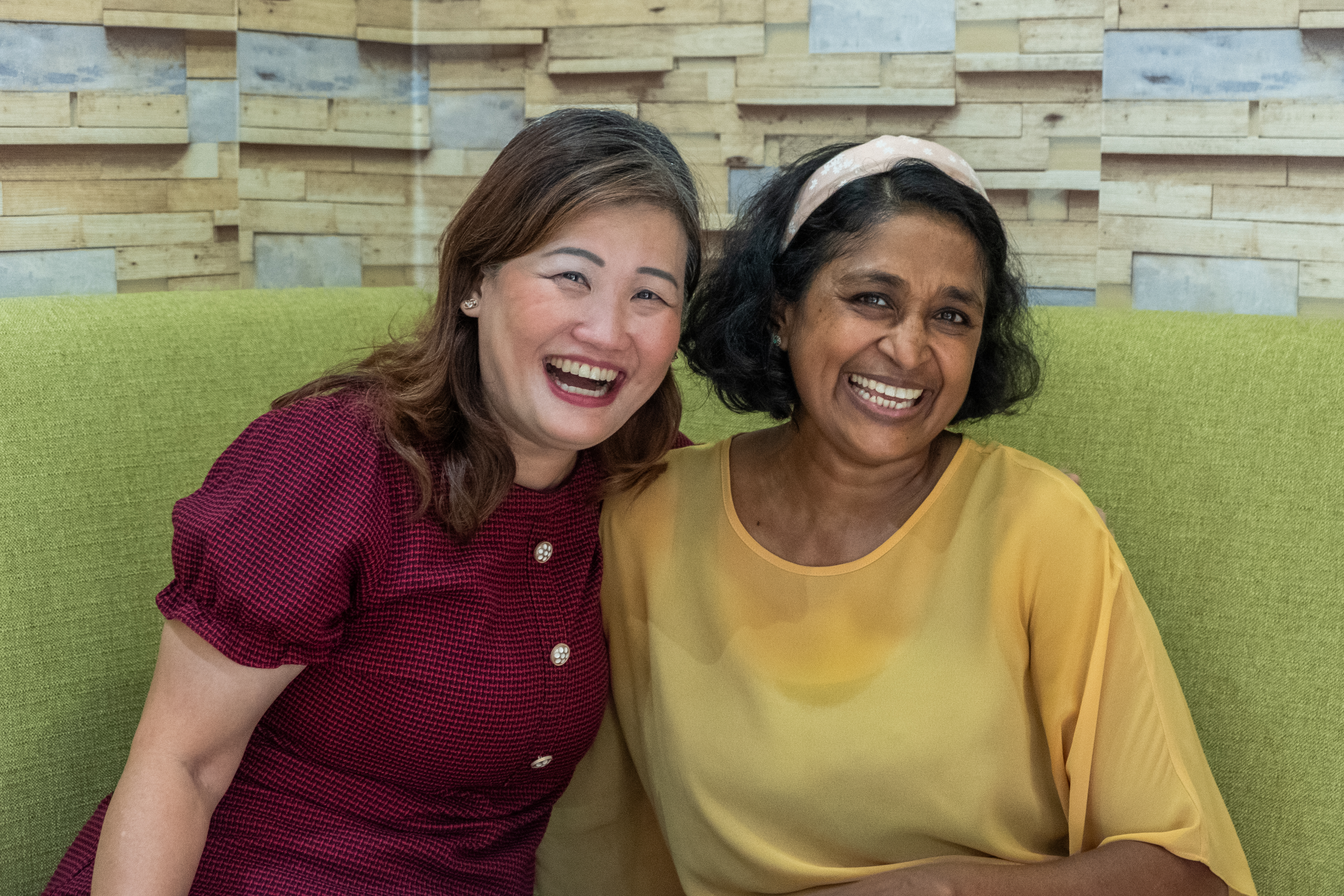 Cynthia on the left, and Upeka on the right, smiling warmly at the camera.