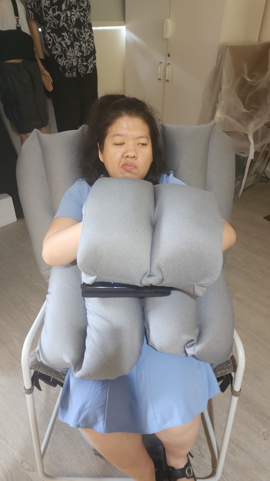 Siew Ling trying out the Huggu.